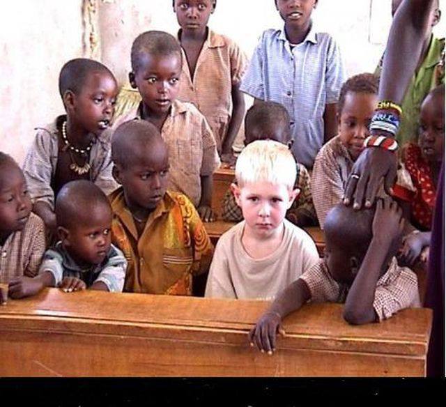 little-black-boys-crowd-around-little-blond-nordic-boy1.jpg